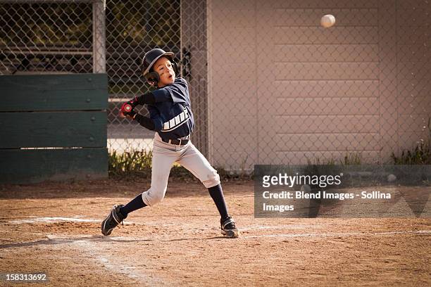 african american boy playing baseball - child batting stock pictures, royalty-free photos & images