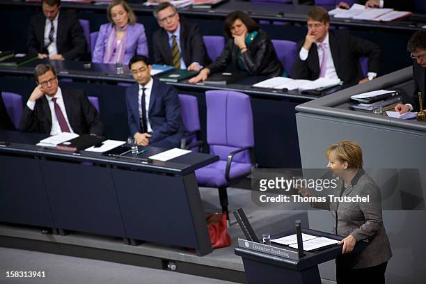 German Chancellor Angela Merkel gives a government declaration at Reichstag, the seat of the German Parliament on December 13, 2012 in Berlin,...