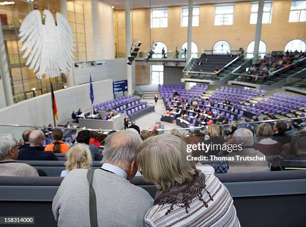 Two visitors talking at Reichstag, the seat of the German Parliament on December 13, 2012 in Berlin, Germany.