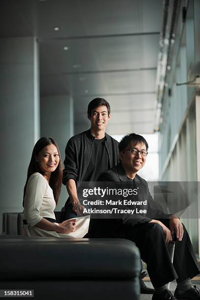 business people sitting together - three people ストックフォトと画像