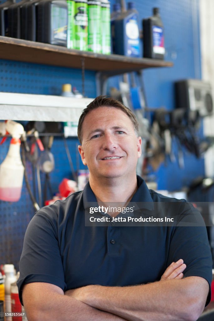 Caucasian worker in auto repair shop