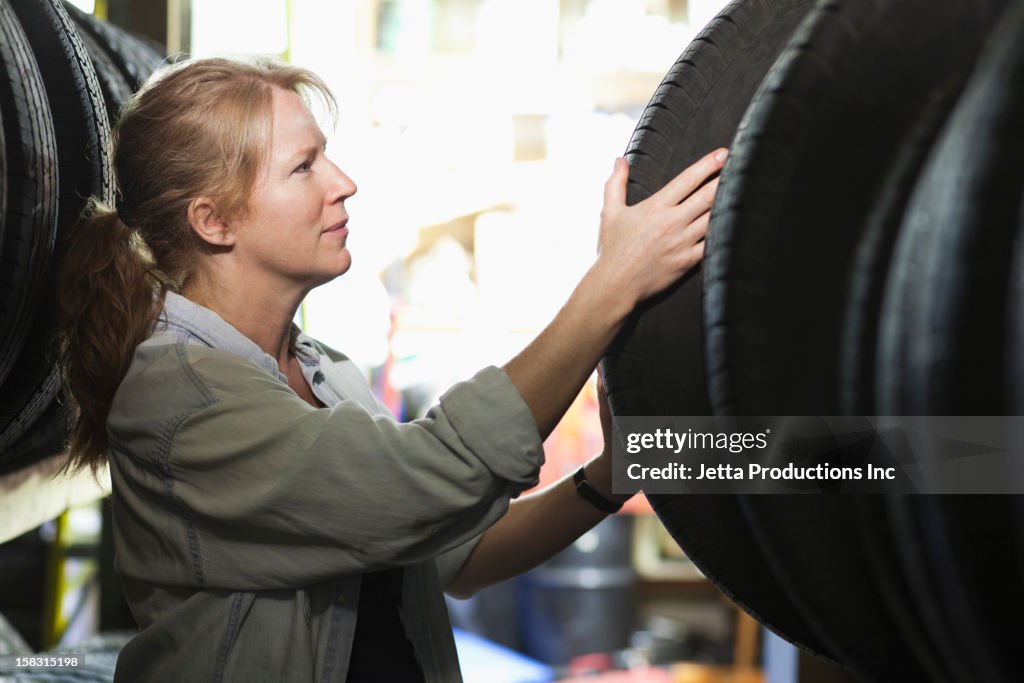 Caucasian worker in tire store