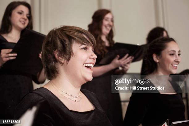 caucasian choir performing on stage - koor stockfoto's en -beelden