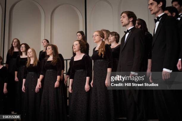 caucasian choir performing on stage - choir stage stockfoto's en -beelden