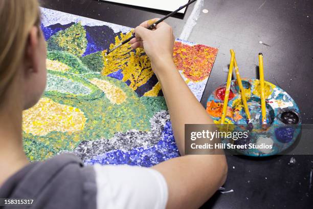 caucasian artist painting - pointillism stock pictures, royalty-free photos & images