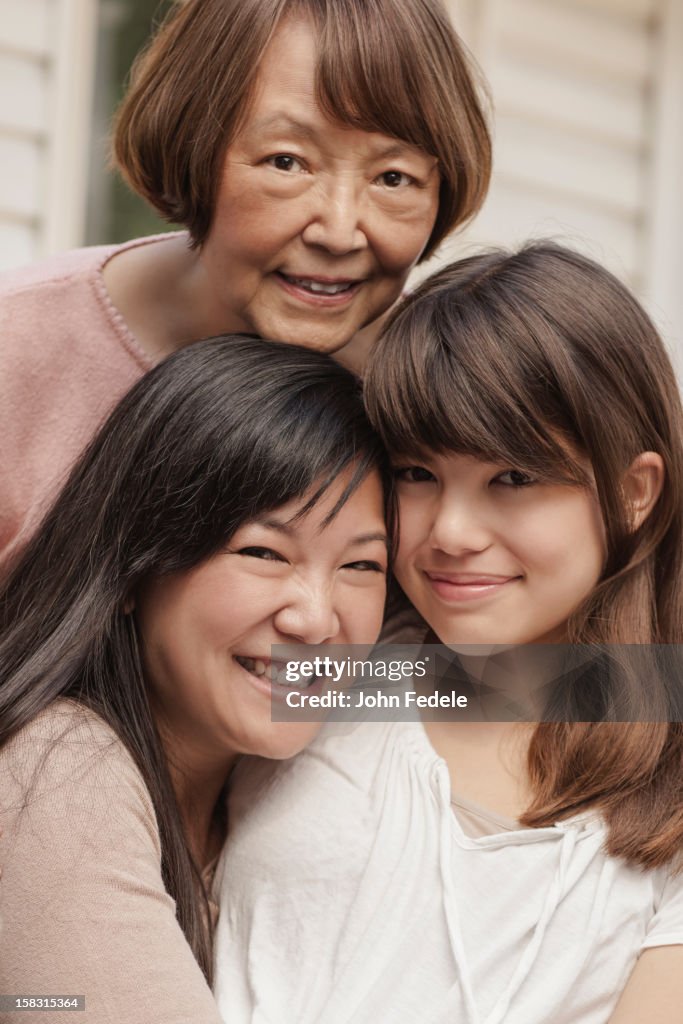 Smiling grandmother, mother and daughter