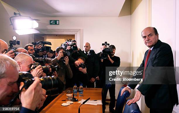 Pier Luigi Bersani, leader of Italy's Democratic Party, right, poses for a photograph as he arrives for a news conference in Rome, Italy, on...