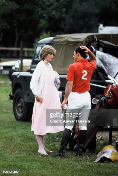 Prince Charles, Prince of Wales and Diana, Princess of Wales, wearing a pink maternity dress with a white cardigan, while pregnant with Prince...