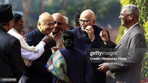 Home Minister Sushil Kumar Shindi with senior BJP leader LK Advani and Sushma Swaraj and other's before paying tributes to the martyrs of 2001...