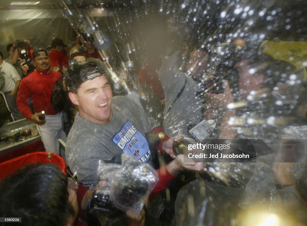 Tim Salmon sprays teammates with champagne after winning the World Series 