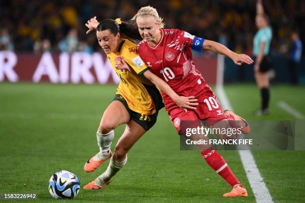 Denmark's forward Pernille Harder and Australia's forward Hayley Raso fight for the ball during the Australia and New Zealand 2023 Women's World Cup...