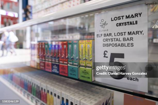 Selection of disposable, single-use vape products advertised for sale in a high street shop as the Local Government Association, a representative...