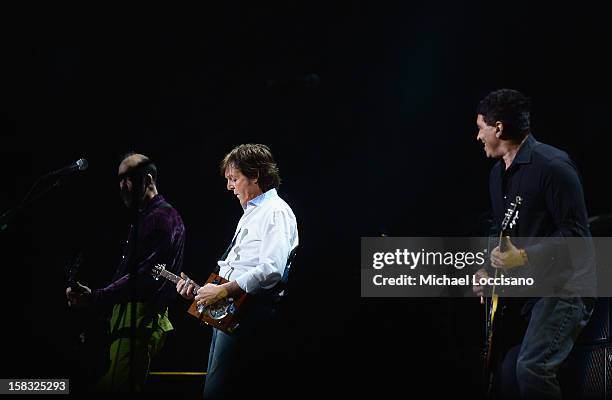 Chris Novoselic, Sir Paul McCartney and Pat Smear perform during the "12-12-12" concert benefiting The Robin Hood Relief Fund to aid the victims of...