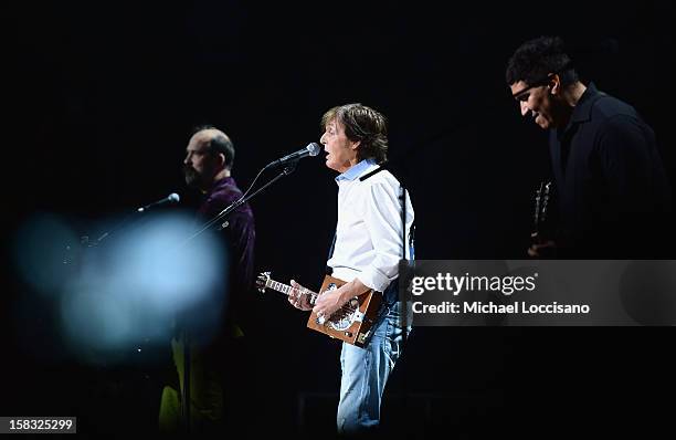 Chris Novoselic, Sir Paul McCartney and Pat Smear perform during the "12-12-12" concert benefiting The Robin Hood Relief Fund to aid the victims of...