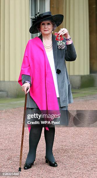 April Ashley holds her Member of the British Empire medal which was awarded to her by Queen Elizabeth II during an Investiture ceremony at Buckingham...