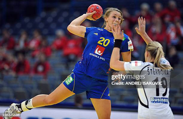 Sweden's Isabelle Gullden vies for the ball with Czech's Helena Sterbova during the Women's EHF Euro 2012 Handball Championship match between Czech...