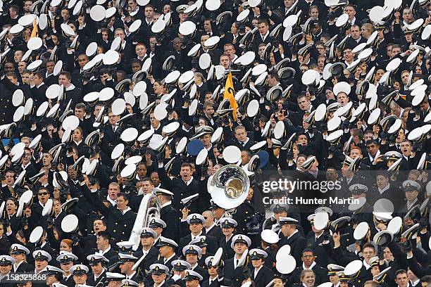 Midshipmen of the Naval Academy cheer before kick-off during a game against the Army Black Knights on December 8, 2012 at Lincoln Financial Field in...