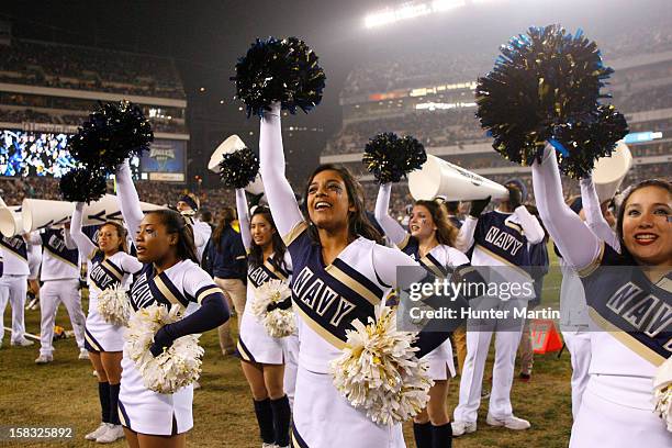 Cheerleaders of the Navy Midshipmen perform during a game against the Army Black Knights on December 8, 2012 at Lincoln Financial Field in...