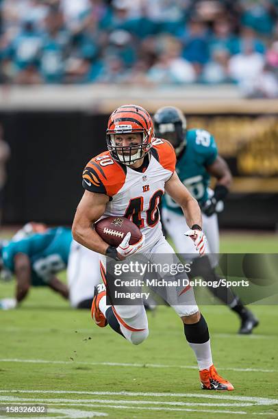 Running back Brian Leonard of the Cincinnati Bengals carries the ball during a NFL game against the Jacksonville Jaguars at EverBank Field on...