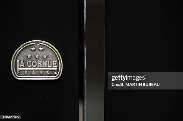 View of French cooker maker "La Cornue's" logo is pictured in the factory on December 13 in Saint-Ouen-l'Aumone, north of Paris. AFP PHOTO / MARTIN...