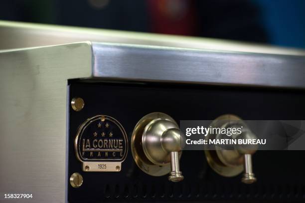 View of French cooker maker "La Cornue's" logo is pictured in the factory on December 13 in Saint-Ouen-l'Aumone, north of Paris. AFP PHOTO / MARTIN...