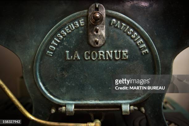 View of French cooker maker "La Cornue's" logo is pictured in the factory on December 13 in Saint-Ouen-l'Aumone, north of Paris. AFP PHOTO / MARTIN...