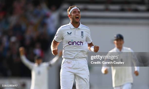 Stuart Broad of England celebrates the wicket of Alex Carey of Australia for the final wicket taken in their final match of their career during Day...