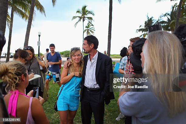 John McAfee interacts with people after speaking to reporters outside of the Beacon Hotel where he is staying after arriving last night from...