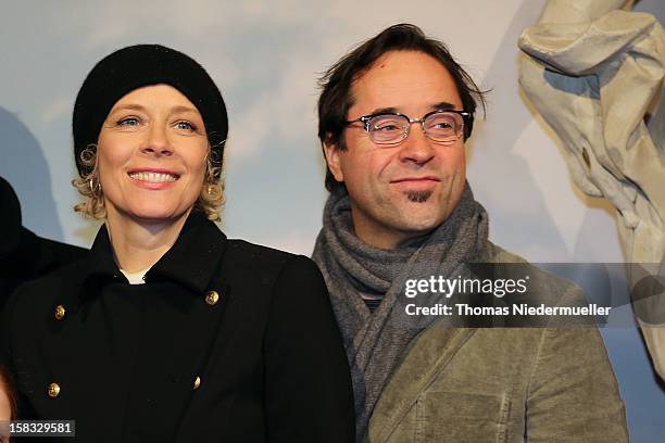 Actor Jan Josef Liefers and actress Katja Riemann attend the red carpet prior to the premiere of 'Baron Muenchhausen' on December 13, 2012 in...