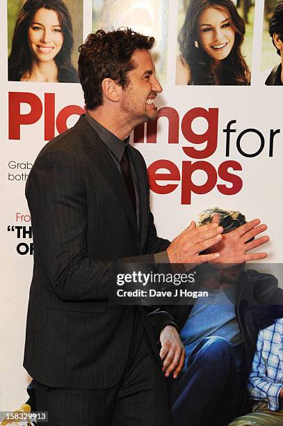 Gerard Butler attends a gala screening of "Playing For Keeps" at The Apollo on December 13, 2012 in London, England.