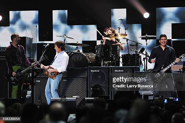 Krist Novoselic, Sir Paul McCartney, Dave Grohl, and Pat Smear perform at "12-12-12" a concert benefiting The Robin Hood Relief Fund to aid the...