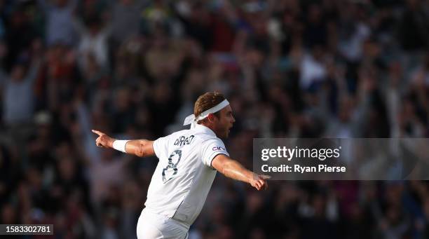 Stuart Broad of England celebrates the wicket of Alex Carey of Australia for the final wicket taken in their final match of their career during Day...