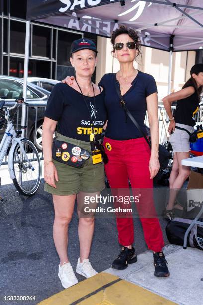 Samantha Mathis and Carla Gugino a seen at the SAG-AFTRA strike in Greenwich Village on July 31, 2023 in New York City.
