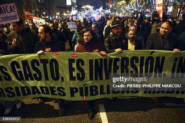 Demonstrators take part in a protest against government's austerity reforms and cuts in Madrid on December 13, 2012. Public spending on education has...