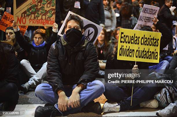 Demonstrators take part in a protest against government's austerity reforms and cuts in Madrid on December 13, 2012. Public spending on education has...