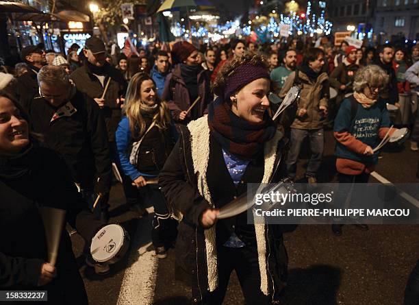 Demonstrators take part in a protest against government's austerity reforms and cuts in Madrid on December 13, 2012. Public spending on education has...