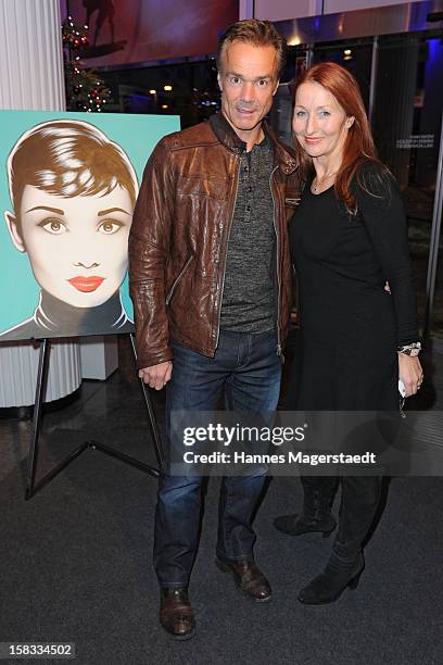 Actor Hannes Jaenicke and Birgitt Wolff attend the BMW Adventskalender opening with Hannes Jaenicke at the BMW Pavillion on December 13, 2012 in...