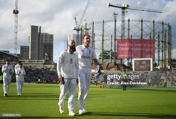Moeen Ali and Stuart Broad of England lead their side off after victory on Day Five of the LV= Insurance Ashes 5th Test Match. Between England and...