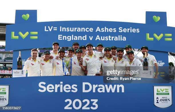 Pat Cummins of Australia lifts the Ashes Urn alongside teammates following Day Five of the LV= Insurance Ashes 5th Test Match between England and...