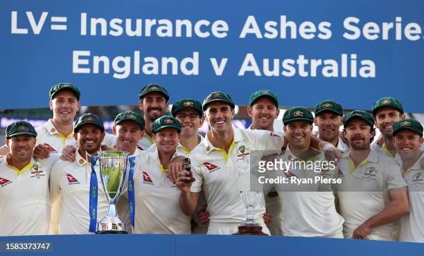Pat Cummins of Australia lifts the Ashes Urn alongside teammates following Day Five of the LV= Insurance Ashes 5th Test Match between England and...