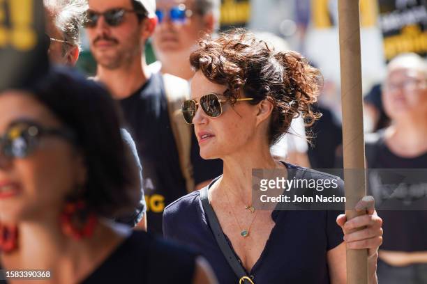Carla Gugino joins SAG-AFTRA members as they maintain picket lines across New York City during strike on July 31, 2023 in New York City.