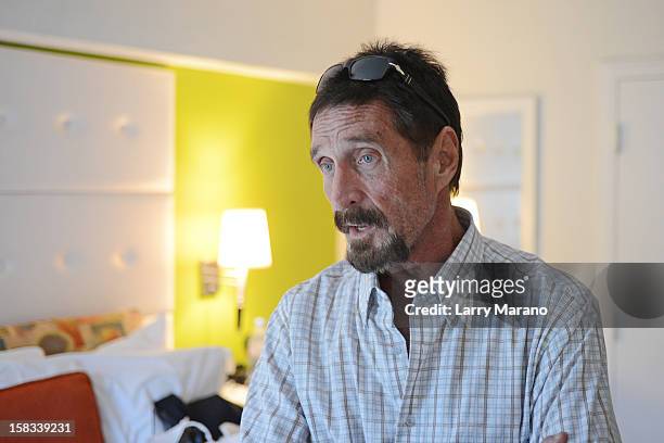 John McAfee poses for a portrait at his hotel in South Beach on December 13, 2012 in Miami Beach, Florida.