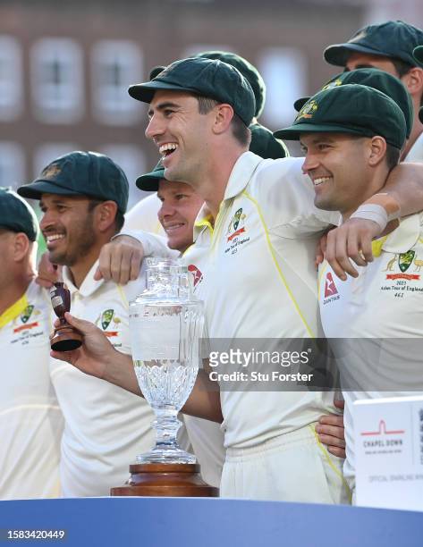 Australia captain Pat Cummins holds the Ashes urn after a 2-2 draw after day five of the LV= Insurance Ashes 5th Test Match between England and...