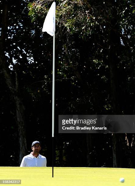 Geoff Ogilvy of Australia chips onto the green on the 16th hole during round two of the Australian PGA Championship at Palmer Coolum Resort on...