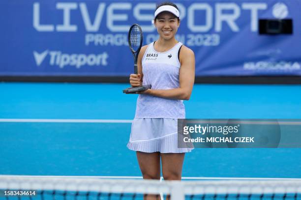 Winner Japan's Nao Hibino celebrates with the trophy after the Women's Single final match against Czech Republic's Linda Noskova at the Prague Open...
