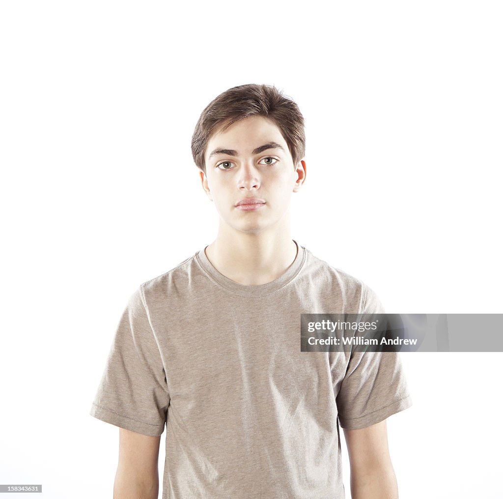 Portait of a teenage boy with a cynical expression