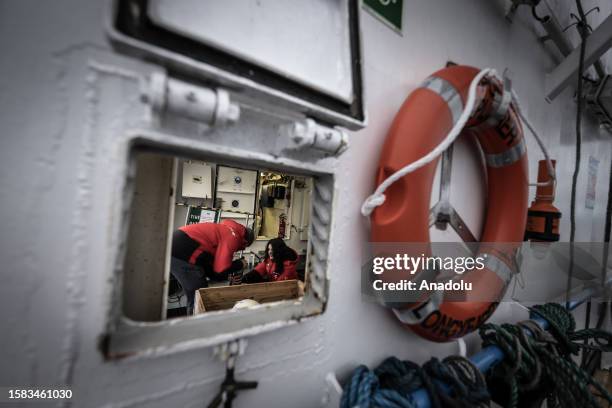 Cagan Sosyal and Chariane Camlia Werlang , members of the 11-person Turkish scientific delegation, work on a scientific study for the 3rd Arctic...