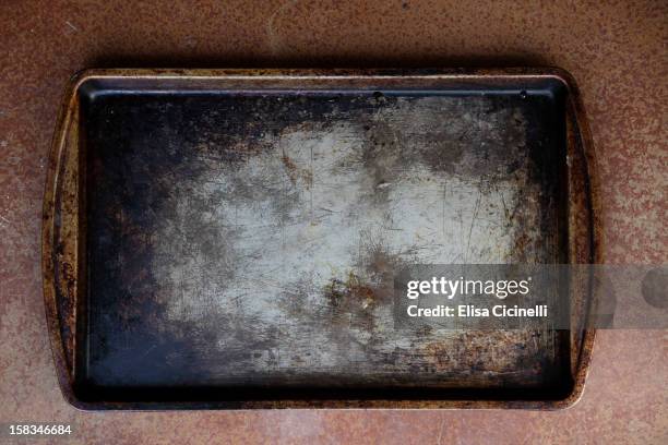 burnt cookie sheet ro baking tray - baking tray stock pictures, royalty-free photos & images