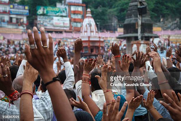 hands of devotees - haridwar stock pictures, royalty-free photos & images