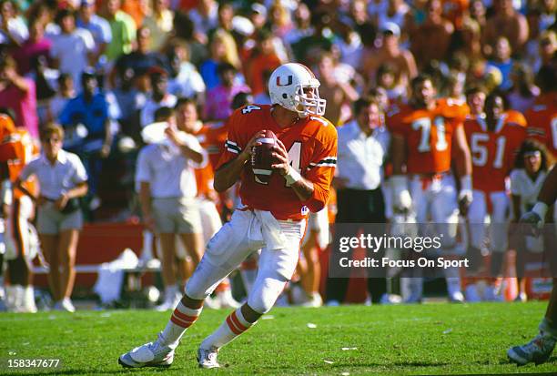 Vinny Testaverde of the Miami Hurricanes drops back to pass against the Florida State Seminoles during an NCAA football game November 1, 1986 at Joe...